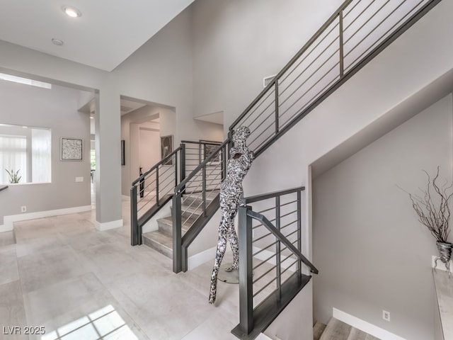 stairs featuring concrete floors