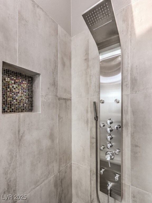 interior details featuring walk in shower