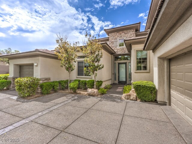 view of exterior entry featuring a garage