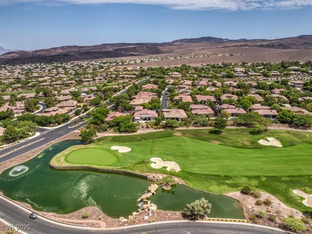 birds eye view of property featuring a water and mountain view