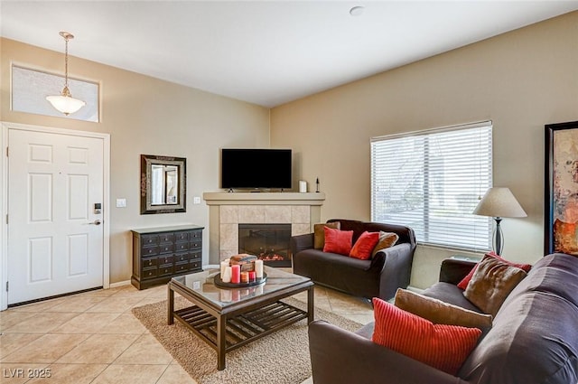 tiled living room featuring a tile fireplace