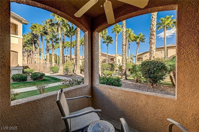 balcony featuring ceiling fan