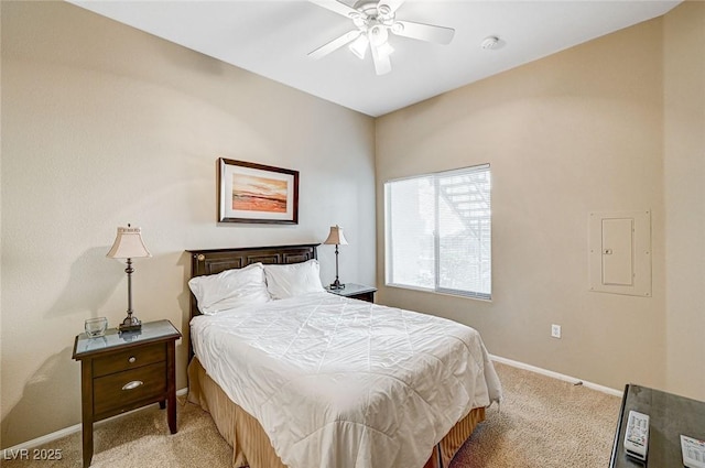 bedroom with ceiling fan, light colored carpet, and electric panel