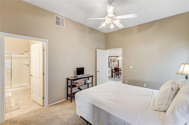 carpeted bedroom featuring ceiling fan and a spacious closet