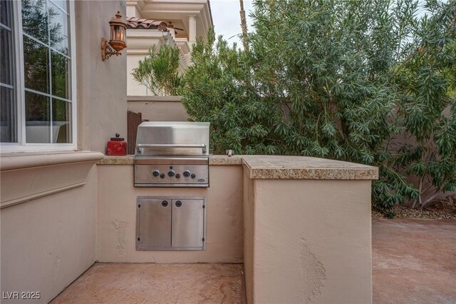 view of patio / terrace with a grill and area for grilling