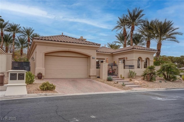 mediterranean / spanish home with a garage