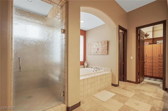 bathroom with separate shower and tub