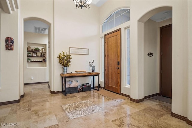 entrance foyer with an inviting chandelier