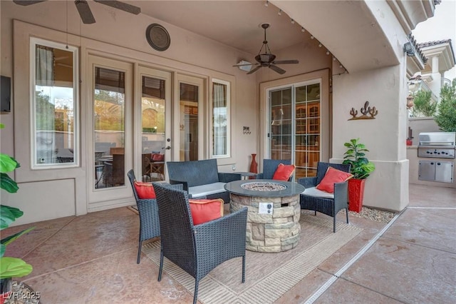 view of patio / terrace featuring a fire pit, grilling area, and ceiling fan