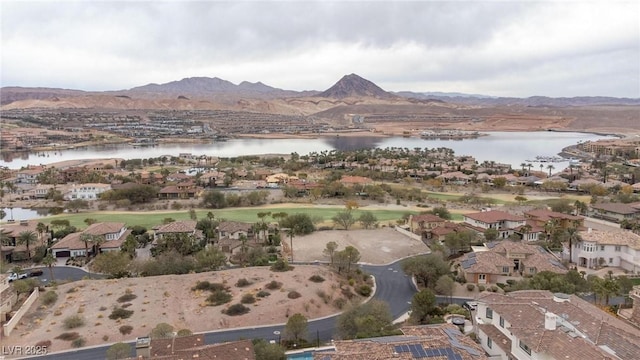 drone / aerial view featuring a water and mountain view