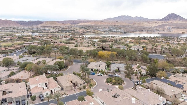 drone / aerial view with a water and mountain view