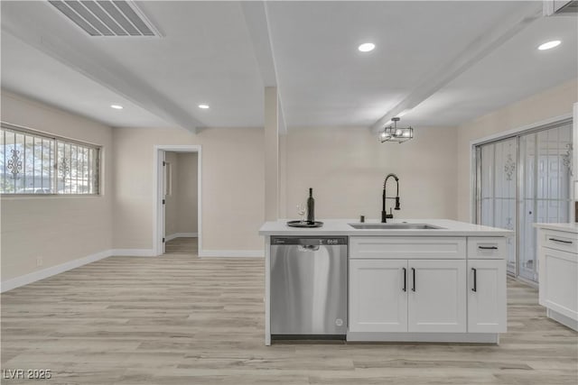 kitchen with light hardwood / wood-style floors, beam ceiling, sink, white cabinetry, and stainless steel dishwasher