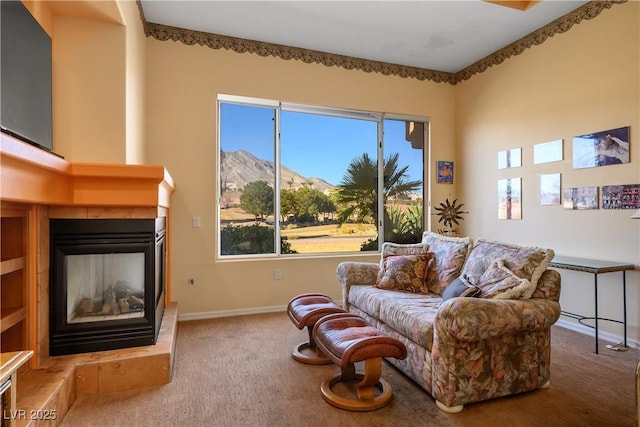 carpeted living room featuring a multi sided fireplace and a mountain view