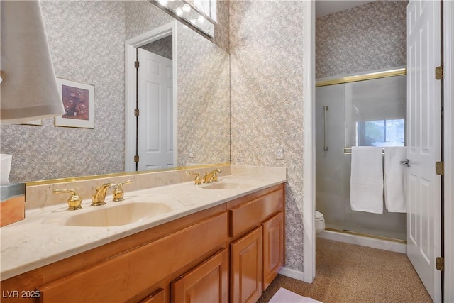 bathroom featuring toilet, an enclosed shower, and vanity