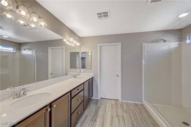 bathroom featuring vanity, hardwood / wood-style floors, and walk in shower