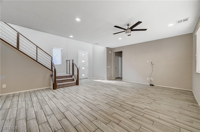 unfurnished living room with ceiling fan and light hardwood / wood-style flooring