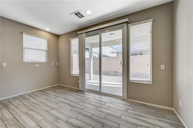 empty room featuring plenty of natural light