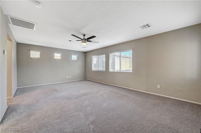 unfurnished room with light carpet and ceiling fan