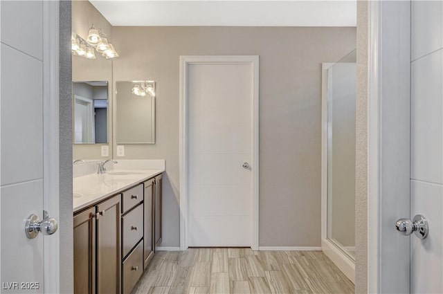 bathroom with a shower and vanity