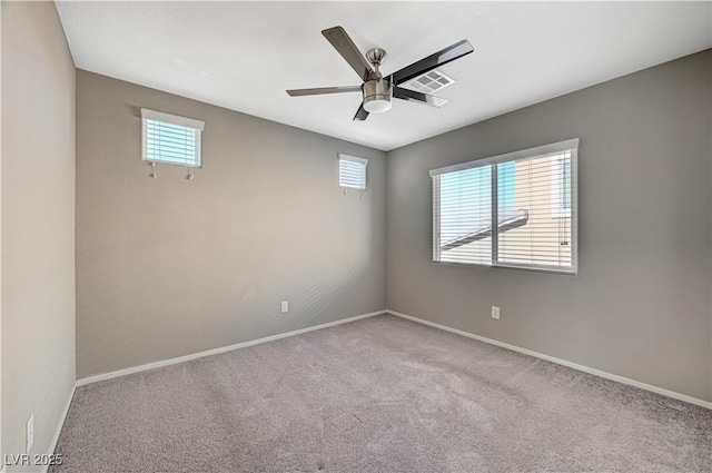 unfurnished room with ceiling fan and light colored carpet