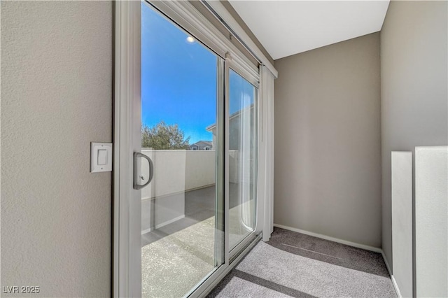 doorway to outside featuring light carpet