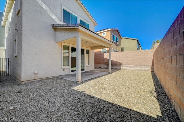 rear view of property with a patio