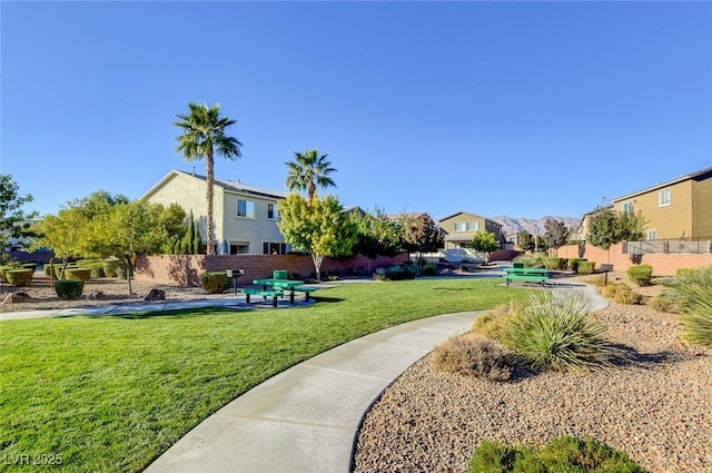 view of property's community featuring a lawn