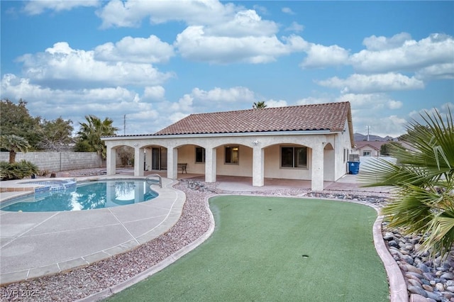 view of swimming pool with an in ground hot tub and a patio