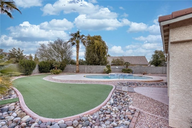 exterior space with a pool with hot tub