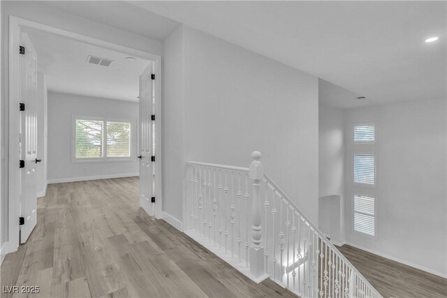 corridor featuring light hardwood / wood-style floors