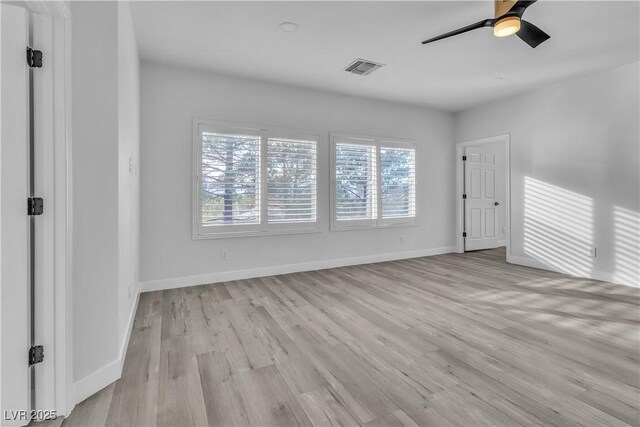 unfurnished room featuring ceiling fan and light hardwood / wood-style flooring