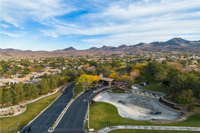 birds eye view of property with a mountain view