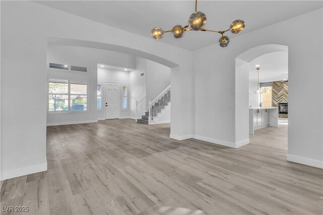 unfurnished living room featuring light hardwood / wood-style flooring