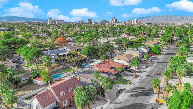 birds eye view of property with a mountain view