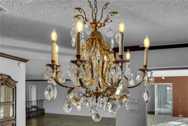 details featuring a textured ceiling and a notable chandelier