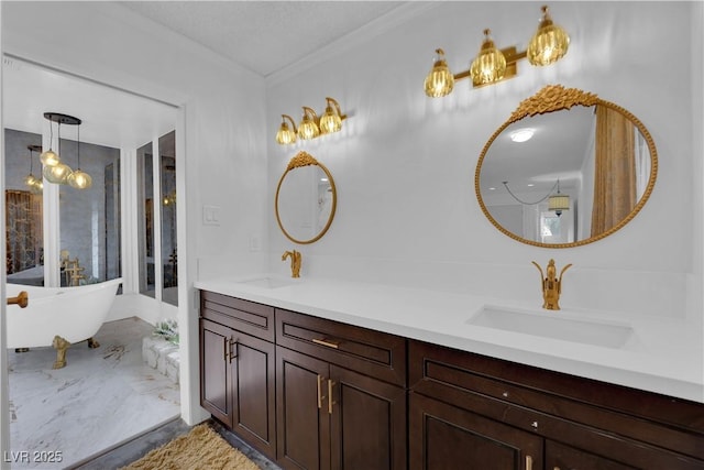 bathroom with ornamental molding, a tub, and vanity