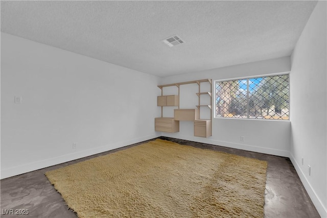 unfurnished living room with a textured ceiling