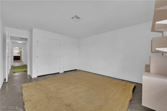 interior space featuring a textured ceiling