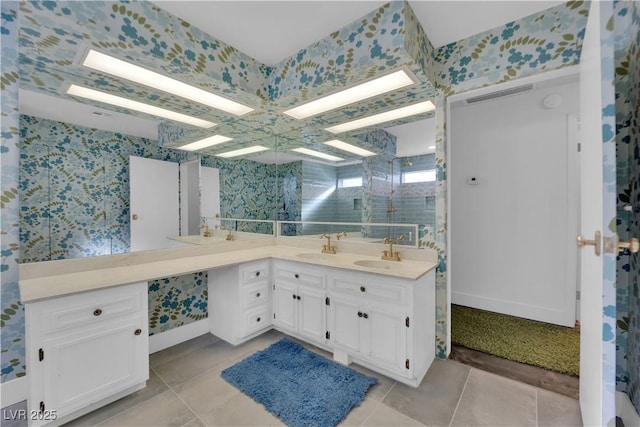 bathroom featuring an enclosed shower, vanity, and tile patterned floors