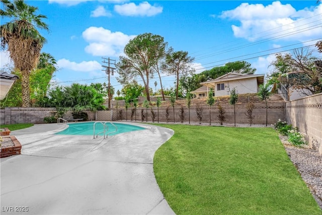 view of pool featuring a yard and a patio