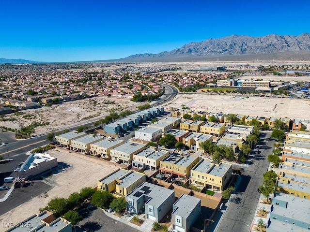 birds eye view of property featuring a mountain view