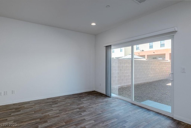 empty room featuring dark wood-type flooring