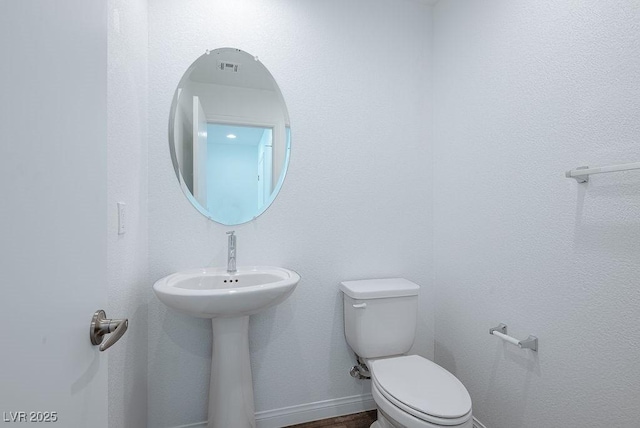 bathroom featuring toilet