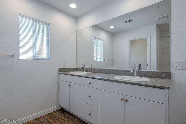 bathroom featuring vanity and hardwood / wood-style floors