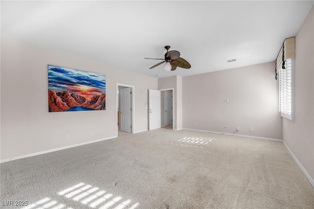 interior space with light colored carpet and ceiling fan