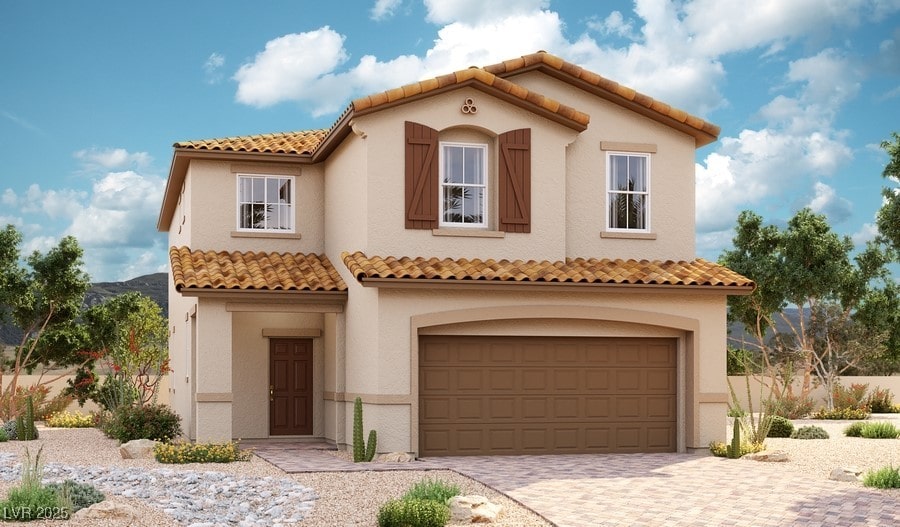 mediterranean / spanish-style house featuring a garage