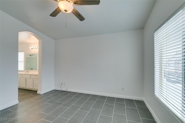 empty room with sink and ceiling fan