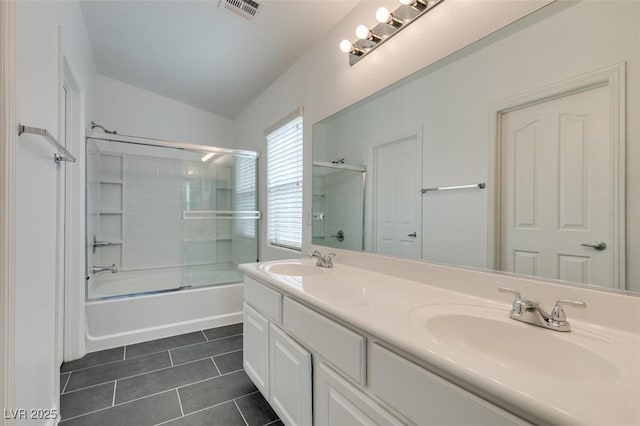 bathroom featuring enclosed tub / shower combo, tile patterned flooring, lofted ceiling, and vanity