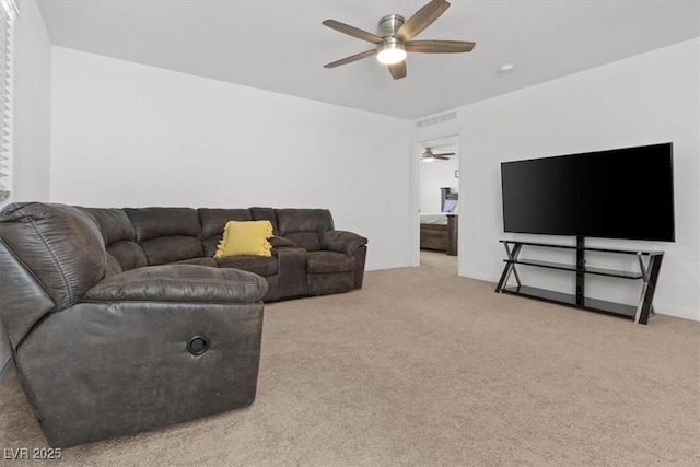 carpeted living room featuring ceiling fan