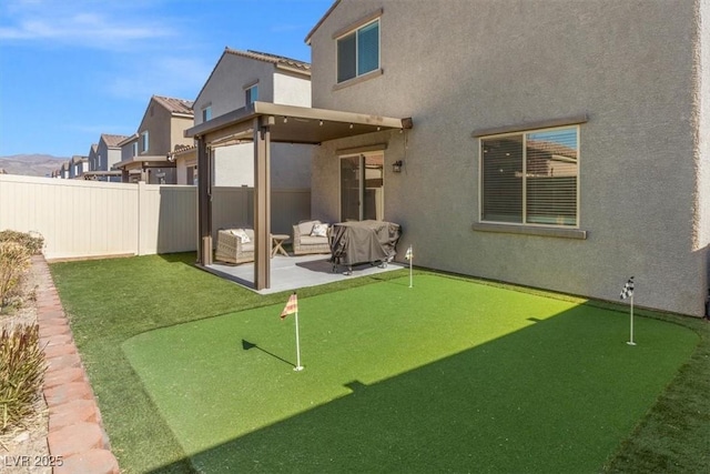 back of property featuring outdoor lounge area and a patio area